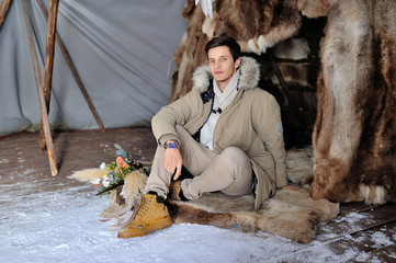 Winter wedding portrait of European bridegroom