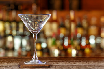 Cocktail glass on the background of the bar