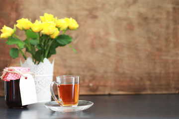 A cup with tea on the table