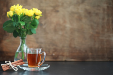 A cup with tea on the table