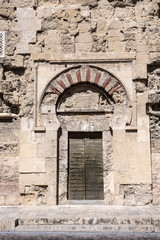Fototapeta na wymiar Bab al-Wuzara gate. of the viziers. of San Esteban, the oldest decorative ensemble of Andalusian architecture, Cordoba, Spain