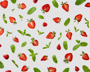 Strawberry and mint leaves isolated on gray background. Creative food concept