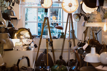 Vintage lighting equipment shop with different types and sizes of lamps.