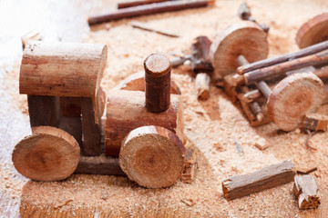 Making a homemade toy made of wood, a children's locomotive train. Creativity and craft.