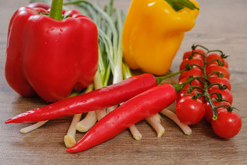Ingredients vegetables for Burritos, tomatoes and peppers on wooden background. Top view