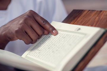 Fototapeta premium Hand of muslim black man people praying with mosque interior background