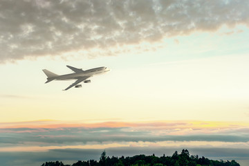 Fototapeta na wymiar an Airplane and the sunset sky