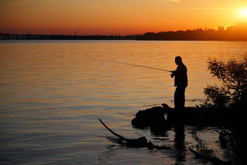 Silhouette of a fisherman