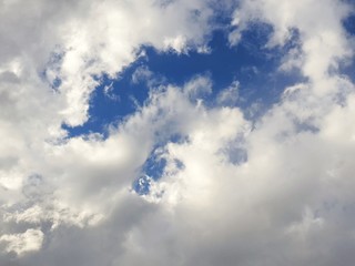 Beautiful nature of blue sky and clouds with the sun shining, sky background, cloudscape concept. Space for text in template, Empty, Looking up