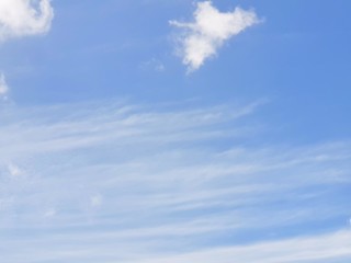 Beautiful nature of blue sky and clouds with the sun shining, sky background, cloudscape concept. Space for text in template, Empty, Looking up