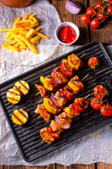 Rustic shish kebab skewers with marinated ham meat paprika and red onion