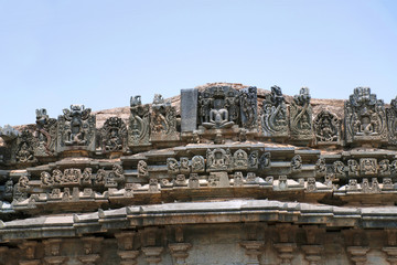 A panel sulpture showing the Jain tirthankara with Yaksha on both the side, Parshvanatha Basadi, Basadi Halli jain temple complex, Karnataka,
