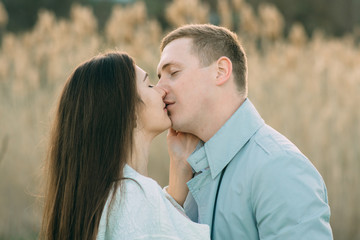 Young couple in love outdoor.Stunning sensual outdoor portrait of young stylish fashion couple posing