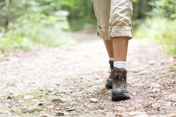 Woman hiker Boots hiking on trail