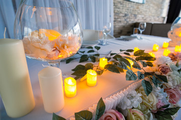 Lighting candles on decorated table for celebration holidays