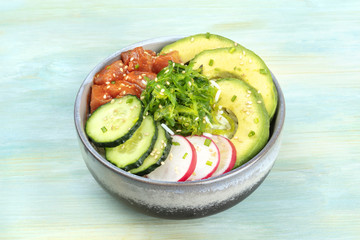 Hawaiian tuna poke salad with wakame, avocado, cucumbers, radish