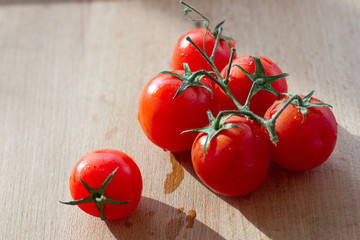 cherry tomato on wood board background
