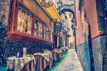 Rustic tables in a narrow alley in world famous Sorrento