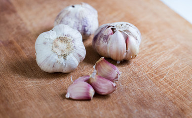 garlic on wood board background