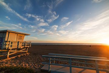 Fototapeta na wymiar Lifeguard hut on the sand In Santa Monica beach at sunset