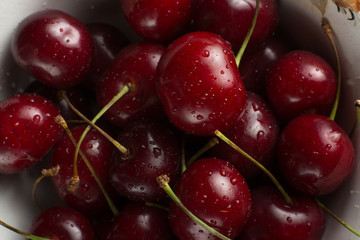 Sweet cherry macro photography close up. Antioxidant, natural, organic, vitamin berry. Selective focus. Drops of water on the surface of berries. Macro background
