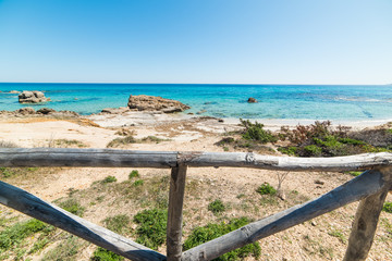 Wooden fence by the sea in Santa Giusta shore