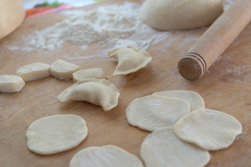 Fototapeta na wymiar Traditional Ukrainian dumplings Vareniki handmade