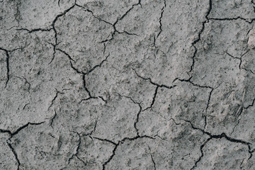 Desert dry and cracked ground.