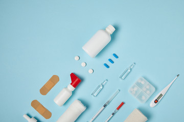 top view of various medical supplies on blue surface