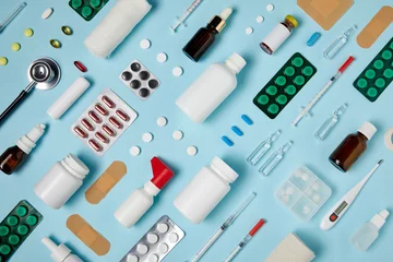 Poster full frame shot of composed various medical supplies on blue surface © LIGHTFIELD STUDIOS