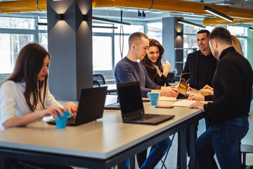 Colleagues smiling while working at the office meeting