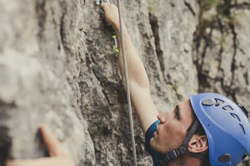 Mountaineer Climbing a Rock