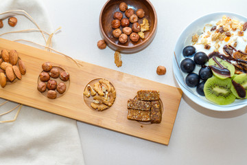 Nuts and Date Palm in Wooden Plate