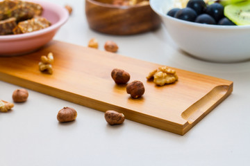 Nuts and Date Palm in Wooden Plate