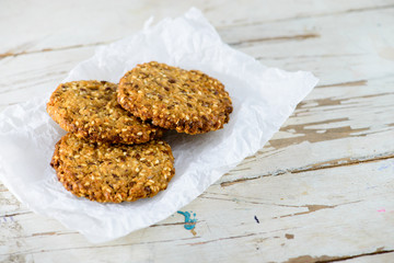 Delicious healthy oatmeal cookies with lime on the wooden backgr