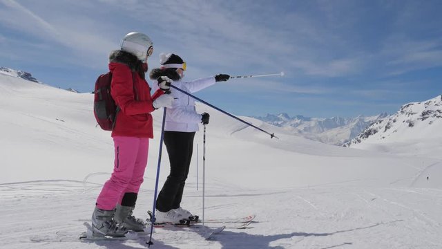 Skiers Saw Interesting In The Mountain Valley And Show Each Other