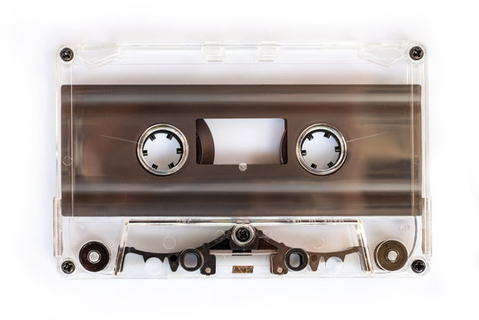 Translucent audio cassette tape isolated on white background
