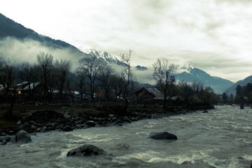 Fototapeta na wymiar River crossing a village in Himalaya mountains