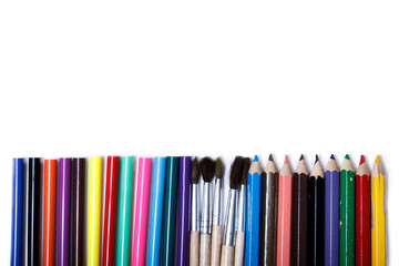 School pencils tassels macro on white background isolate