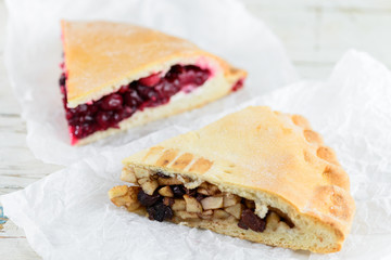 Piece of sweet ranberry cake and slice of homemade organic apple