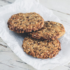 Delicious healthy oatmeal cookies with lime on the wooden backgr