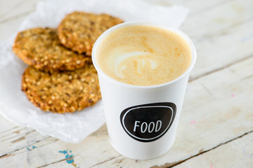 Delicious healthy oatmeal cookies with lime and cup of fresh cof