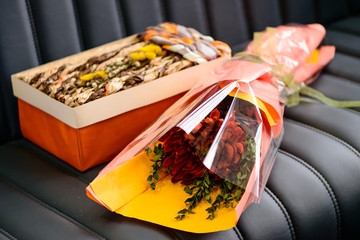 Holiday decor concept. Handmade gift box and creative bouquet of