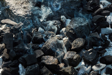 Black coal and ash, prepared for barbecue grill