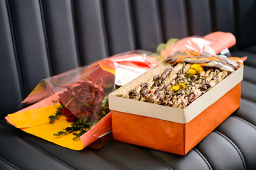 Holiday decor concept. Handmade gift box and handmade bouquet of