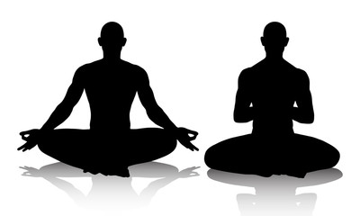 Silhouttes of men practicing yoga in the lotus position