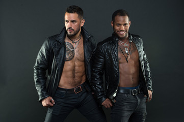 Men on smiling faces with bristle and tattoos. Fashion and style concept. Men with sexy muscular...