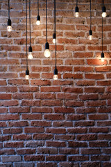 Fototapety  Old red brick wall with bulb lights lamp