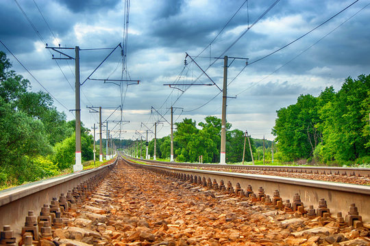 Railway on the background of summer nature and forest.