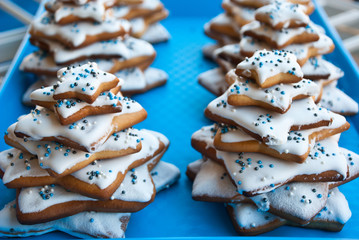 Homemade christmas trees from biscuits and glaze. Symbol of new year.